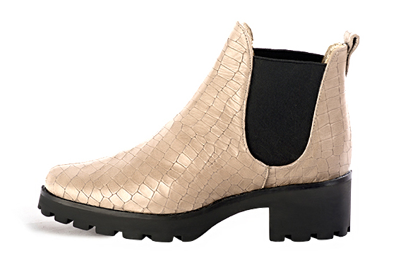Tan beige and matt black women's ankle boots, with elastics. Round toe. Low rubber soles. Profile view - Florence KOOIJMAN